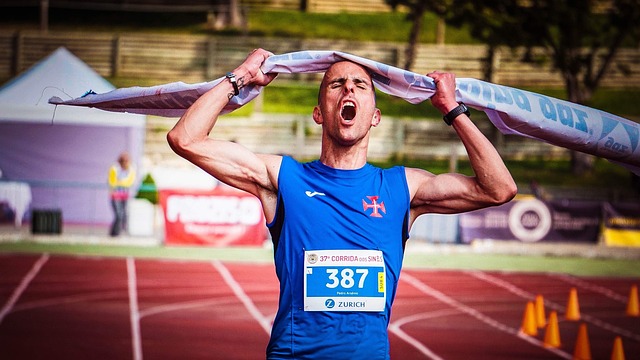 Athlete jubilantly crossing the finish line